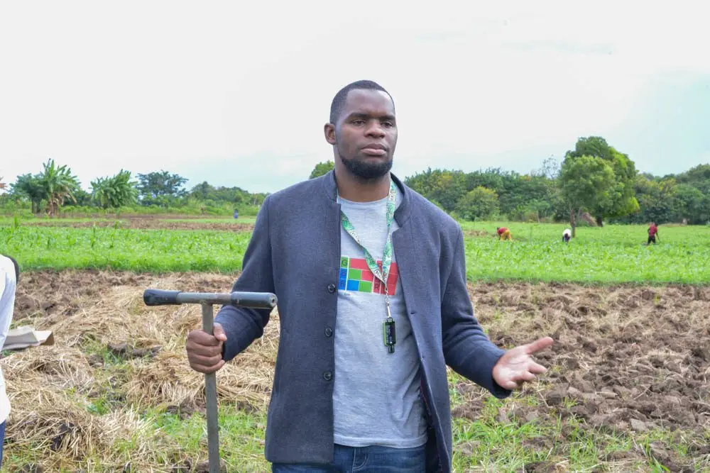 A VIA field officer with a soil auger at Matabwa, Malawi